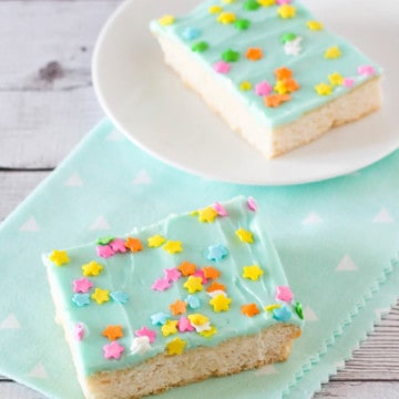 gluten free sugar cookie bars with frosting and sprinkles