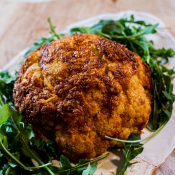 Whole Baked Cauliflower with Cheddar and Parmesan