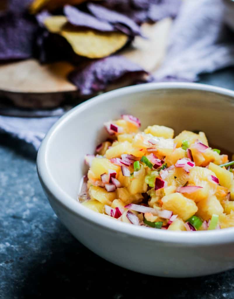 Grilled pineapple salsa  in a white bowl