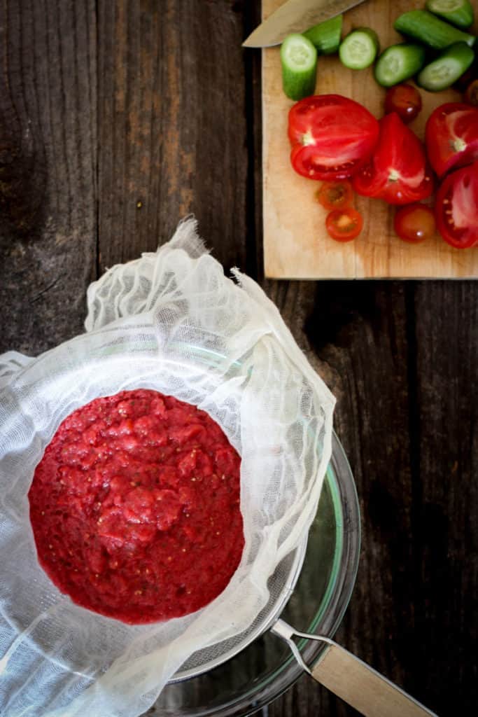 tomato pulp in a strainer for making tomato water