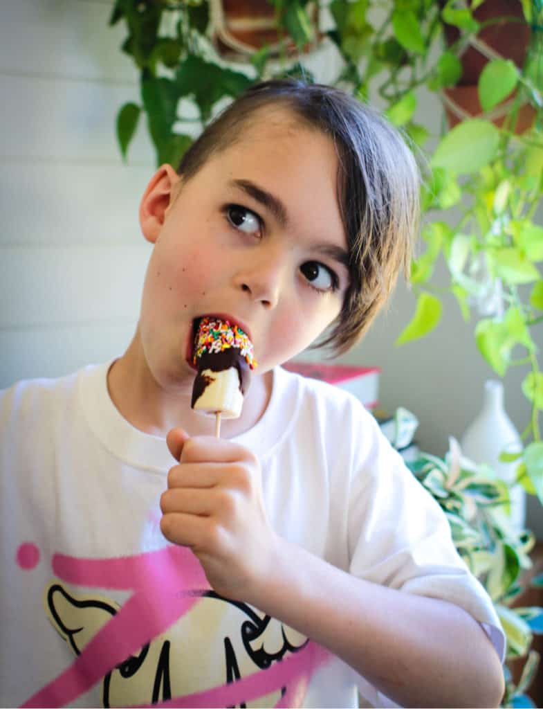 child enjoying frozen banana popicle
