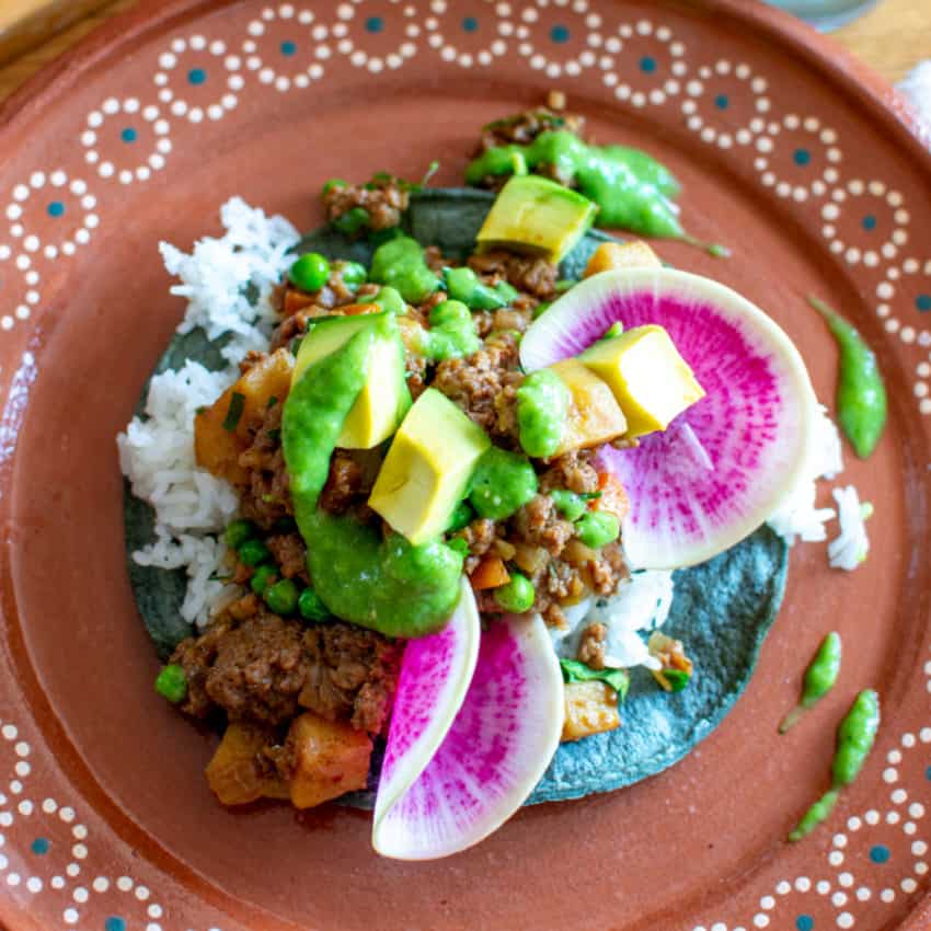 Vegan Picadillo Tostadas with Rice and Peas on plate