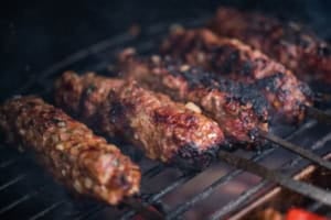 lula kabob on skewers on a grill