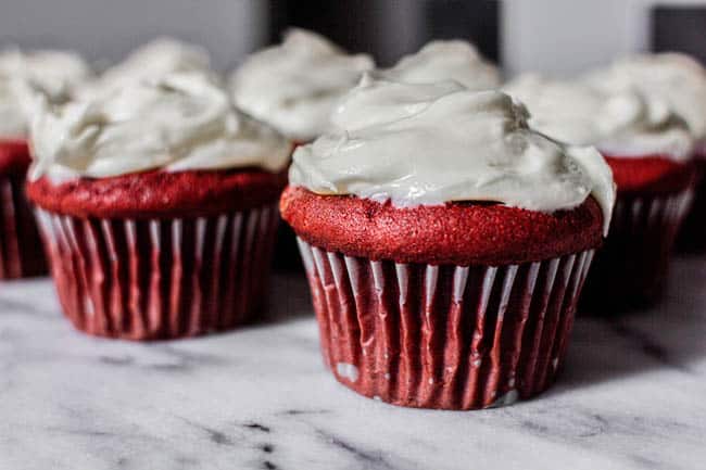 A batch of red velvet cupcakes on marble background