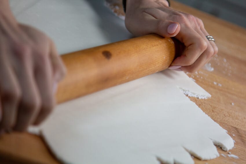 hand & rolling pin rolling out fondant 
