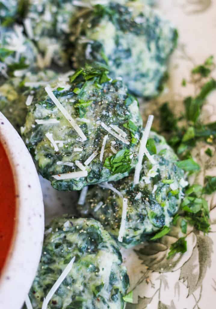 close up of spinach and ricotta dumplings - how to make gnudi