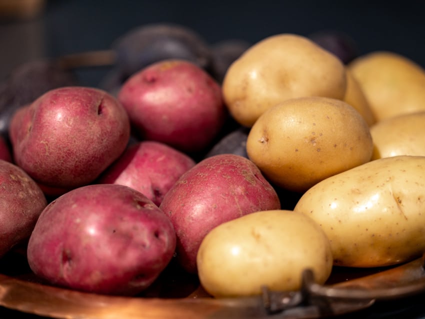 new potatoes on a copper tray