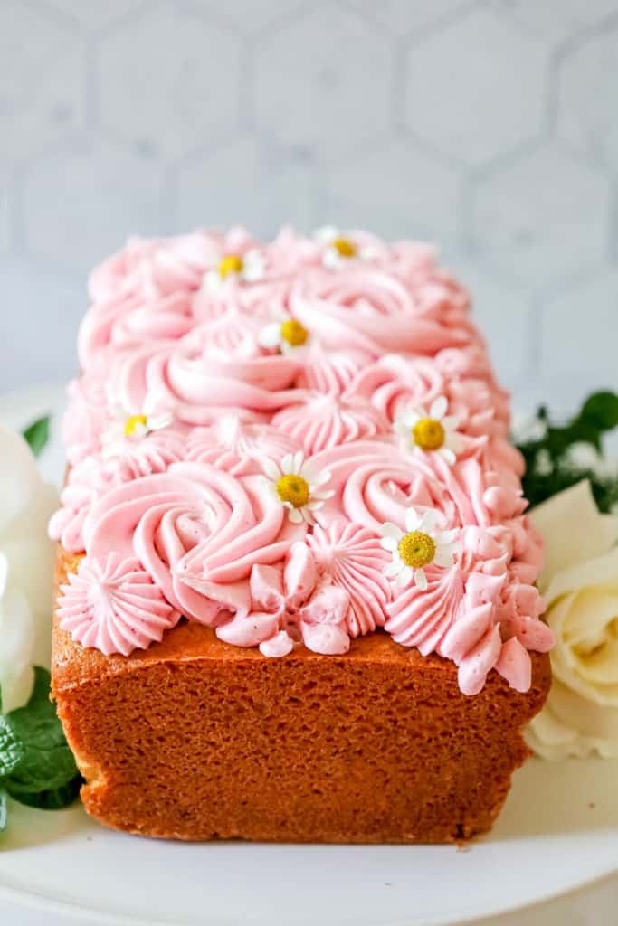 lemon loaf cake with beautiful pink frosting from a girl defloured