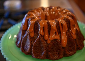adding easy chocolate glaze to a bundt cake