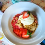 dish of strawberry rhubarb crisp with ice cream