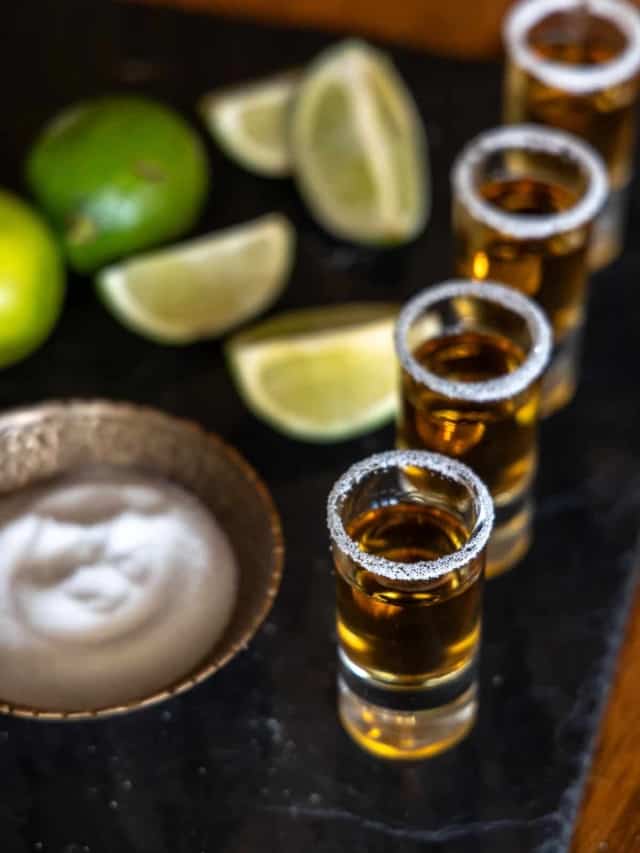 shots of tequila on a tray with salt and lime