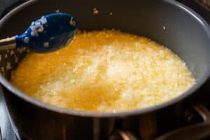 cooking a pot of white onions