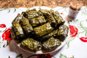 plate of Rice Stuffed Grape Leaves Recipe: Yalanchi Sarma